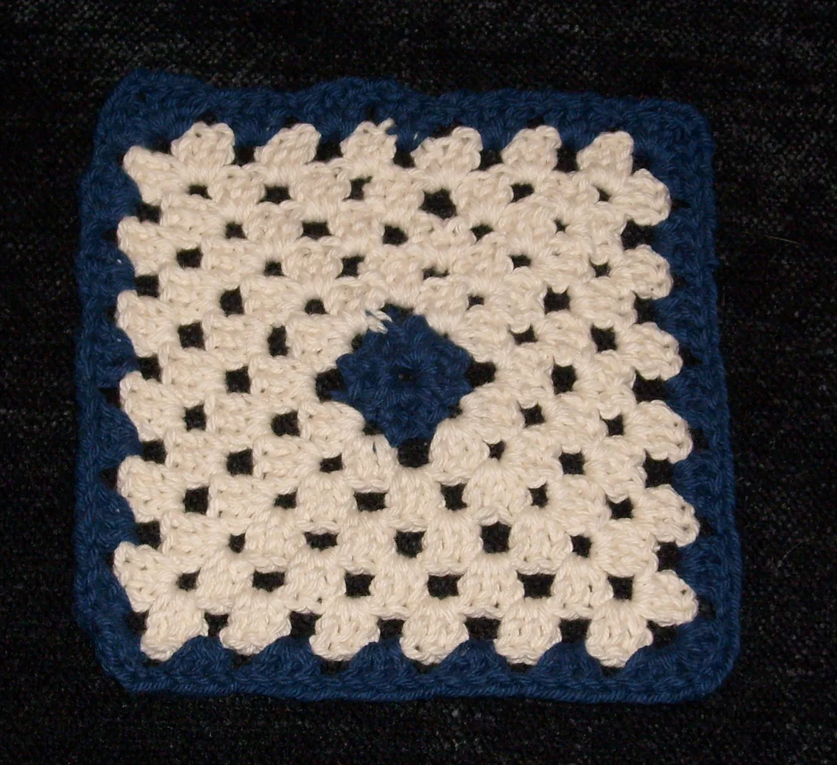 A real cotton granny square for studying a regular module, not the exhibition’s pattern.