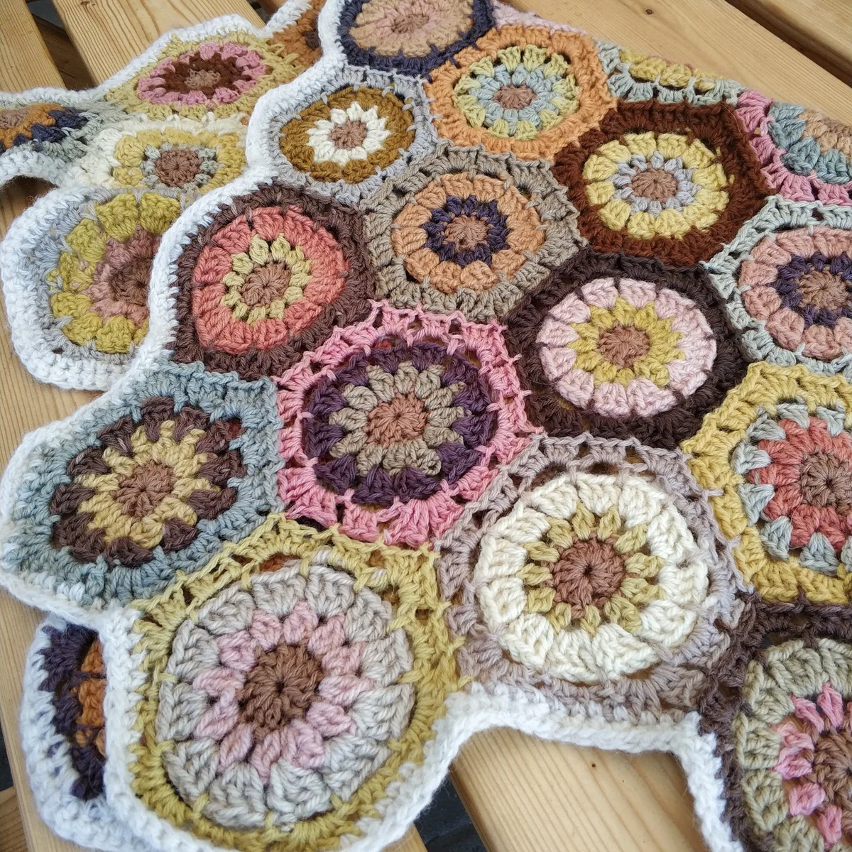 A real blanket made with naturally dyed yarn, a colour-and-material reference, not evidence of the artist’s dyes or materials.