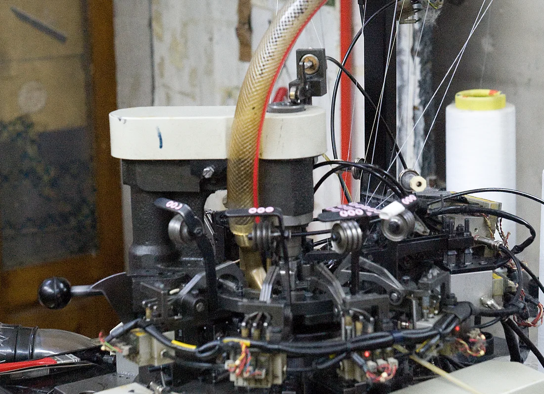 Sock-making equipment photographed in Aleppo, Syria, in 2009. An industrial comparison, not a Ukrainian or Dodo Socks factory photograph.