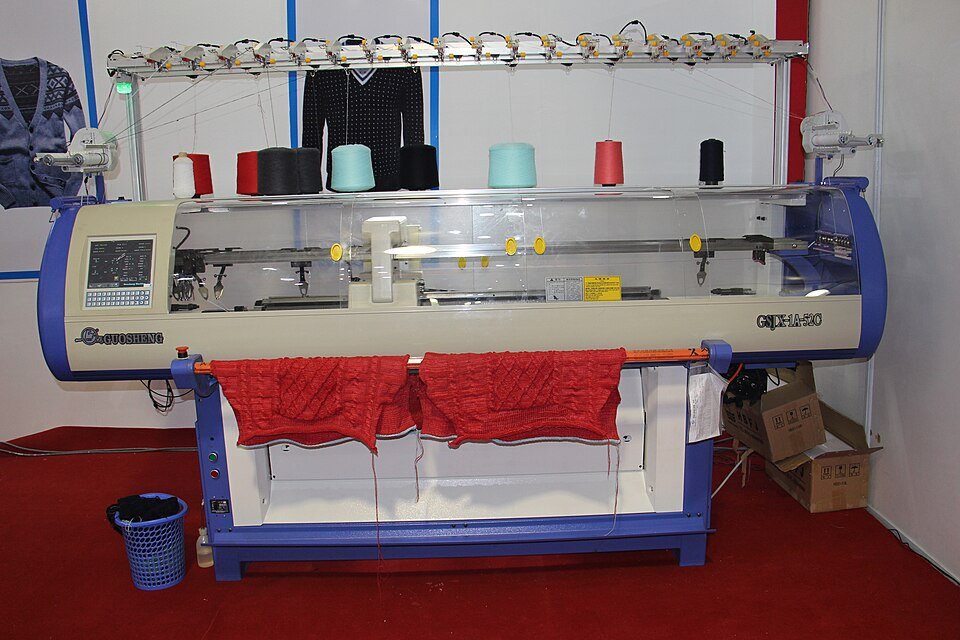 Front view of a modern Chinese computerized flat machine, a different generation and purpose from the 1964 glove machine.