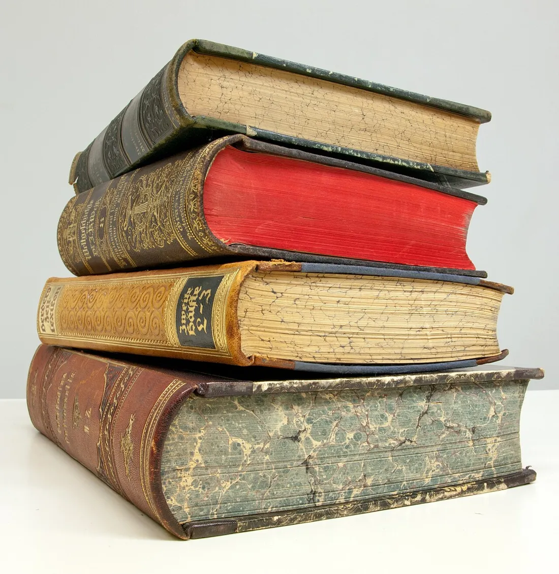 Four old books, shown as a reading-material reference. Not books donated to Chen’s project or her own bookshelf.